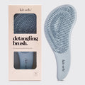 Detangling brush in haze blue with flexible bristles for smooth, tangle-free hair and sleek design for on-the-go styling